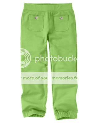 Knit pants have elastic at the ankle and clear gem buttons on the 